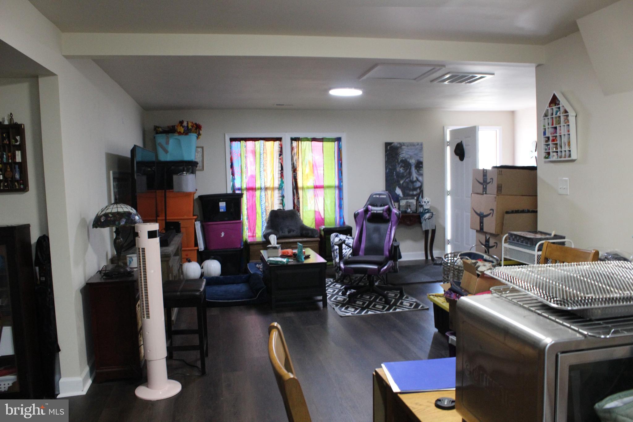 2740 Belsches Road Bumpass, VA 23024 - Photo 6 of 15 a room with furniture a rug and a window