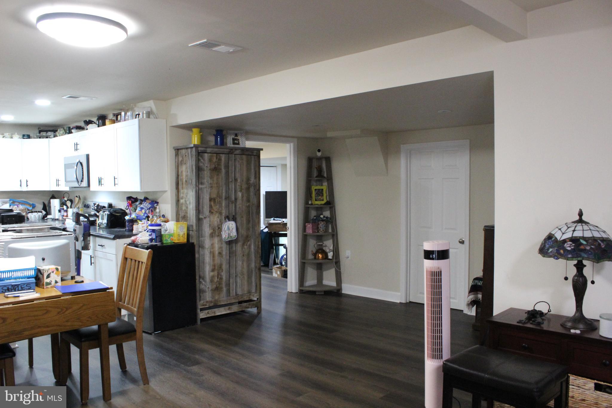 2740 Belsches Road Bumpass, VA 23024 - Photo 7 of 15 a view of a kitchen with dining room and wooden floor