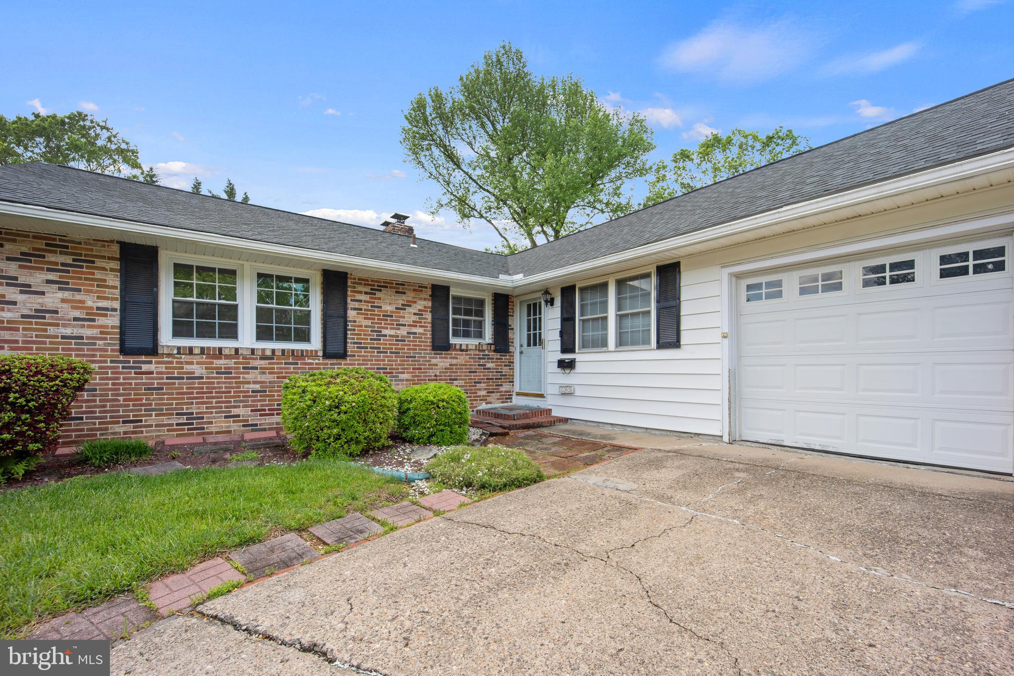 705 Halstead Road Wilmington, DE 19803 - Photo 3 of 34 a front view of a house with a yard and potted plants