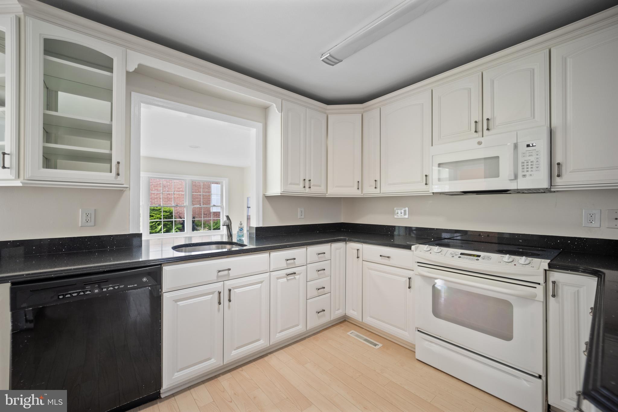 705 Halstead Road Wilmington, DE 19803 - Photo 10 of 34 a kitchen with white cabinets and white appliances