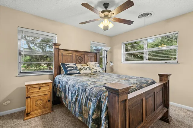 a bed room with a bed and a chandelier