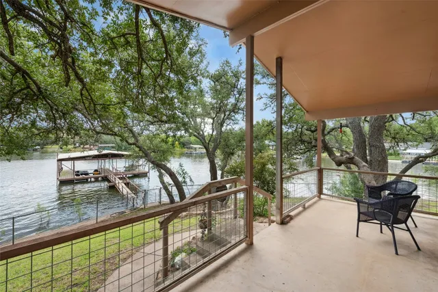 a view of a balcony with chairs
