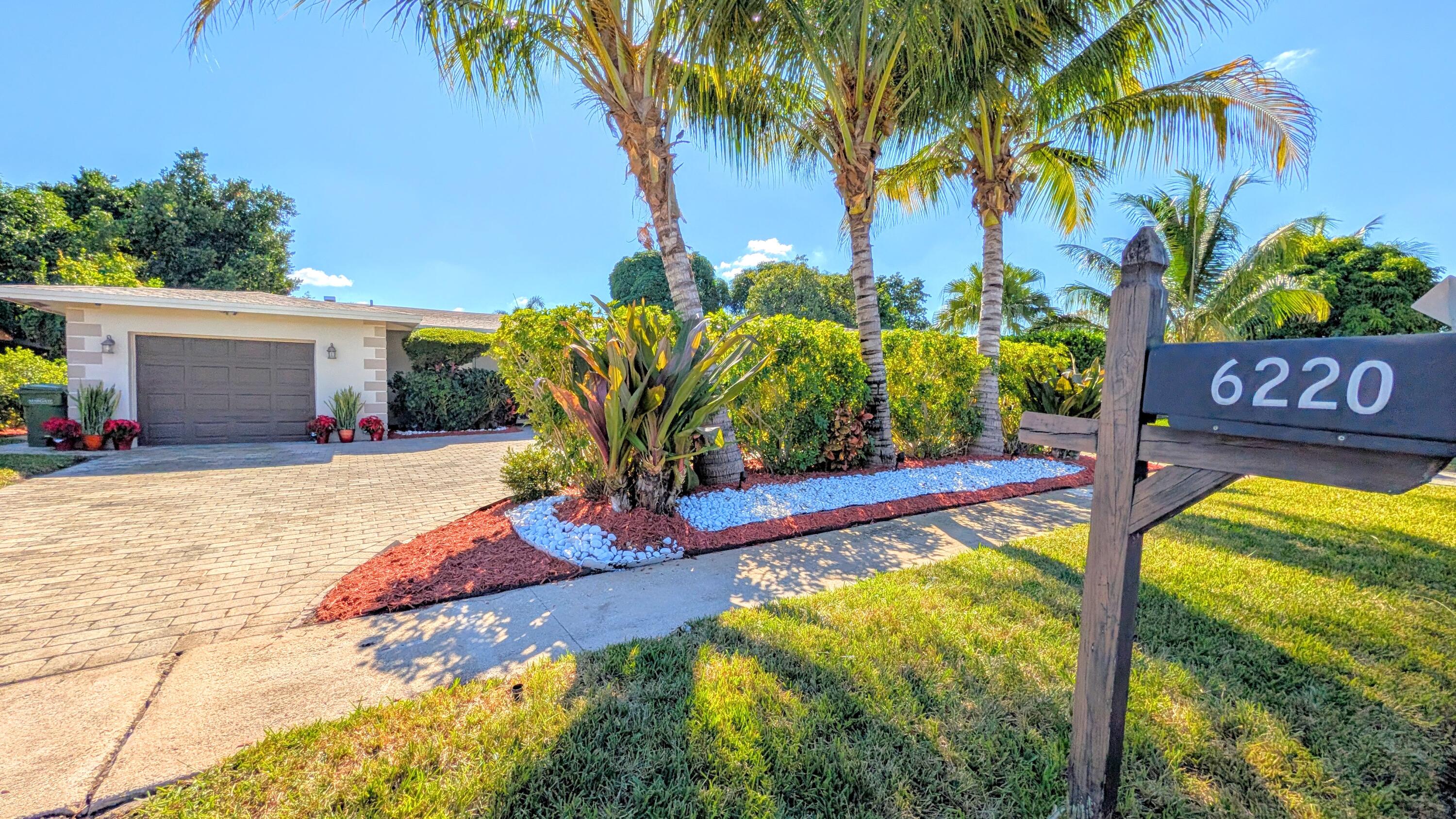 a view of a swimming pool with an outdoor space and seating area