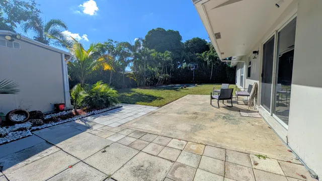 a bed room with a bed mirror and a window