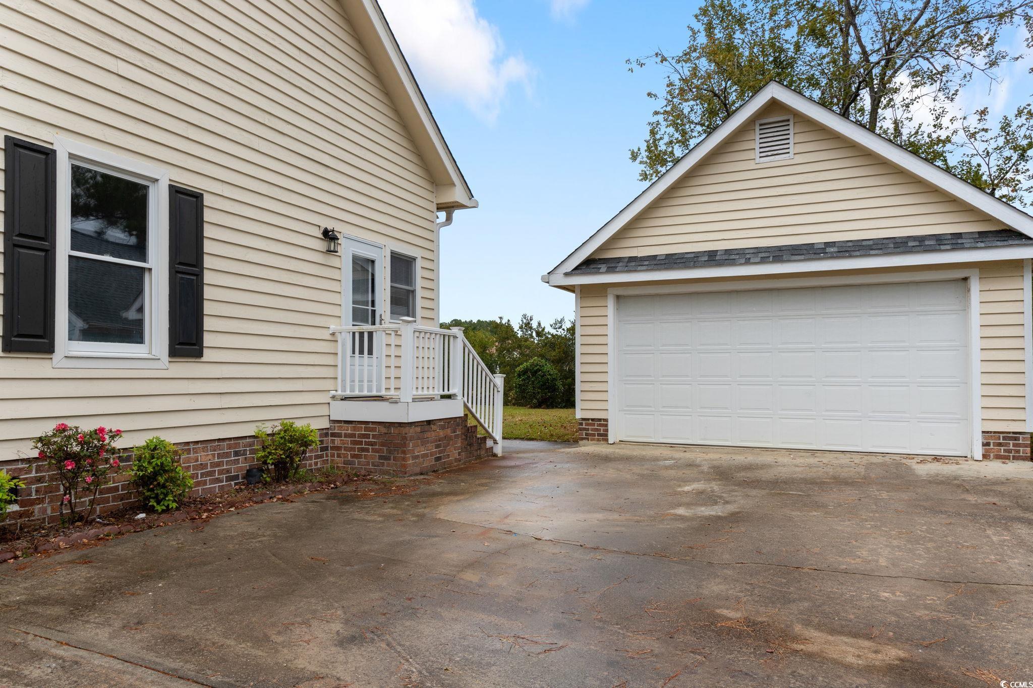 2321 Brick Drive Longs, SC 29568 - Photo 3 of 40 View of side of home with an outbuilding and a detached garage