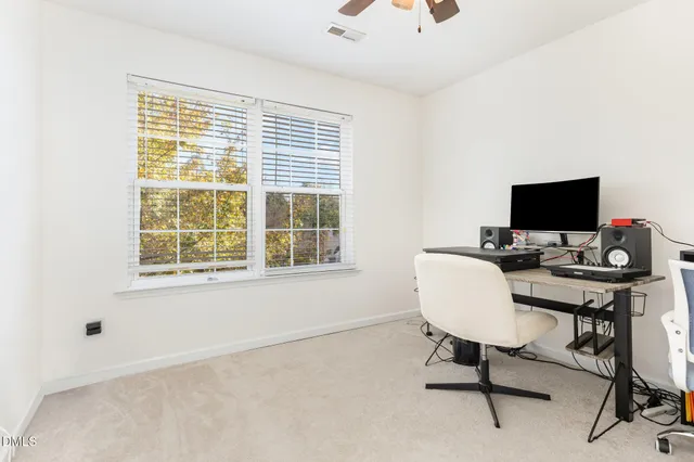 a kitchen with stainless steel appliances a stove a sink dishwasher a refrigerator and a microwave oven with white cabinets