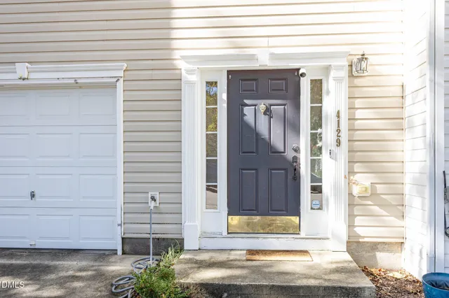 a view of a house with a tree