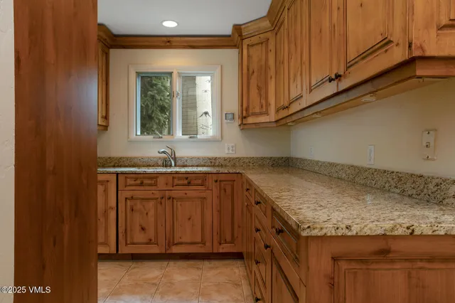 a kitchen with stainless steel appliances a stove and a refrigerator