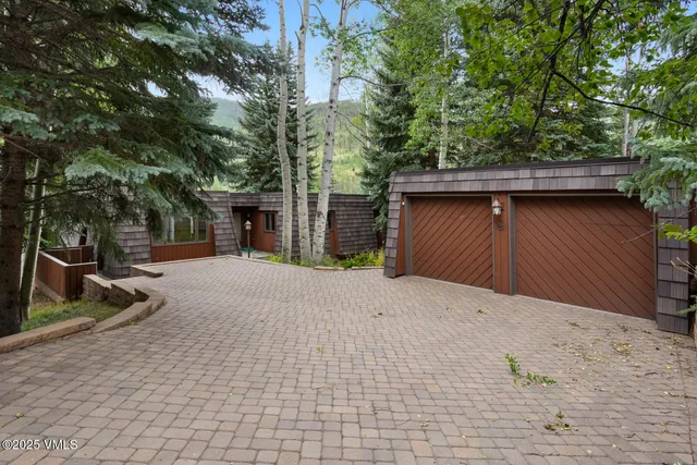 a house with trees in front of it
