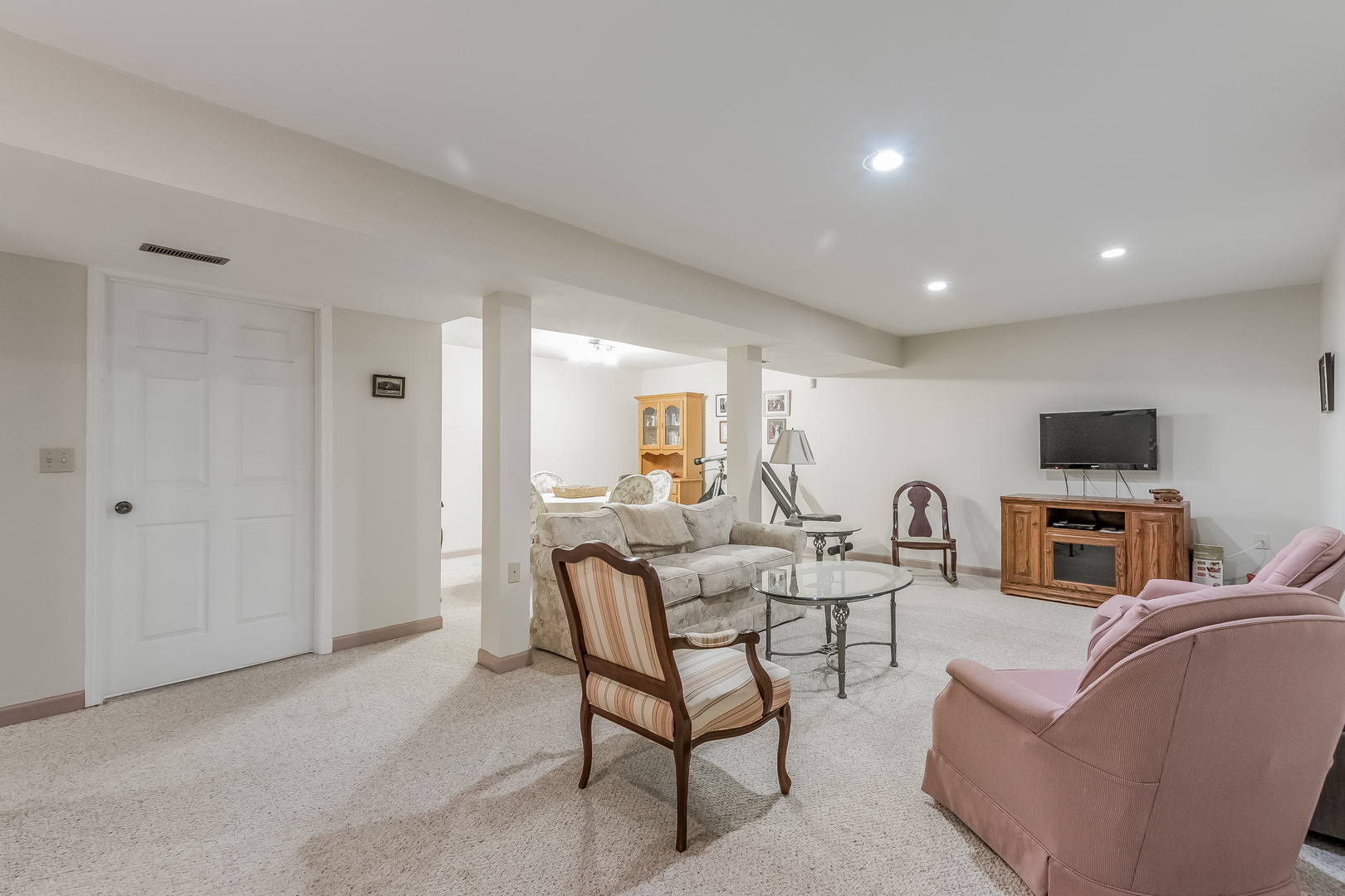 7911 South Sugar Island Road Chebanse, IL 60922 - Photo 13 of 16 a living room with furniture a flat screen tv and kitchen view