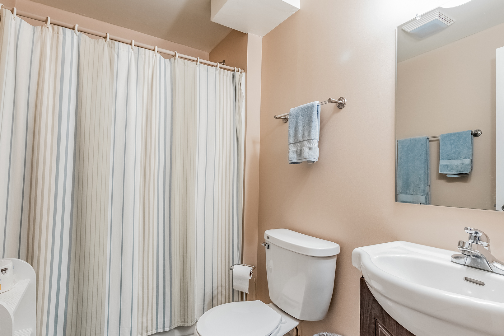 7911 South Sugar Island Road Chebanse, IL 60922 - Photo 15 of 16 a white toilet sitting next to a bathroom sink