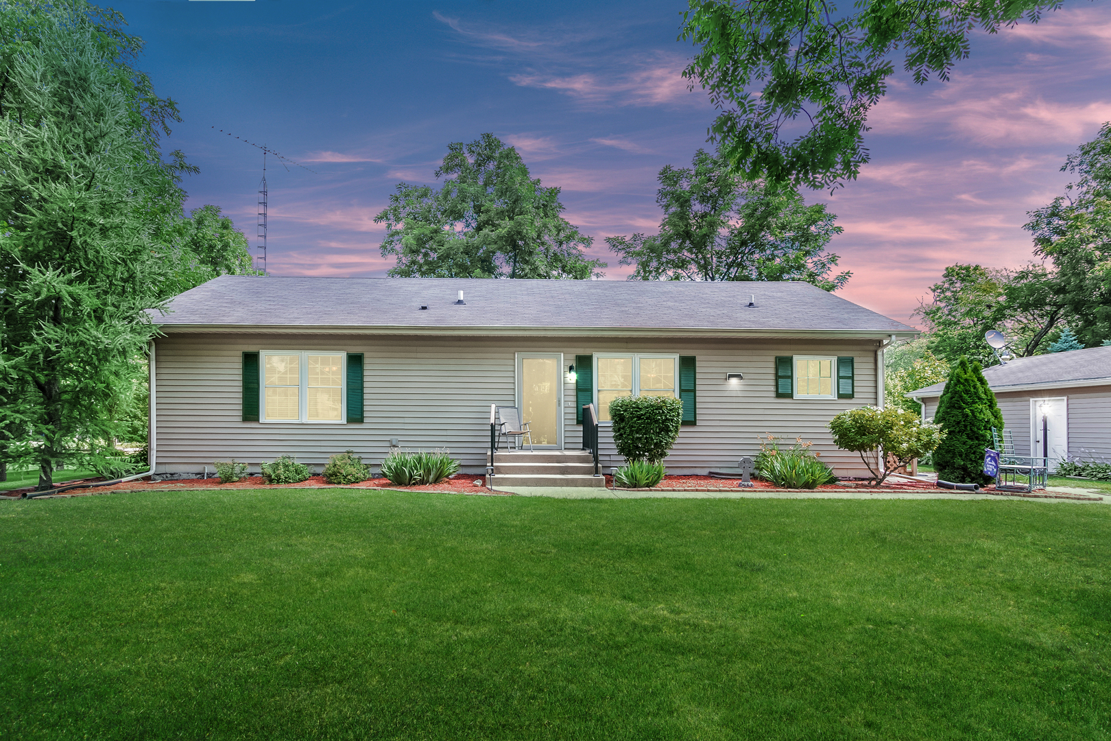 7911 South Sugar Island Road Chebanse, IL 60922 - Photo 16 of 16 a front view of house with a garden and patio