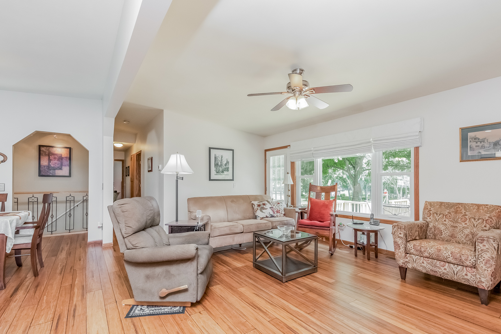 7911 South Sugar Island Road Chebanse, IL 60922 - Photo 5 of 16 a living room with furniture a fireplace and a large window