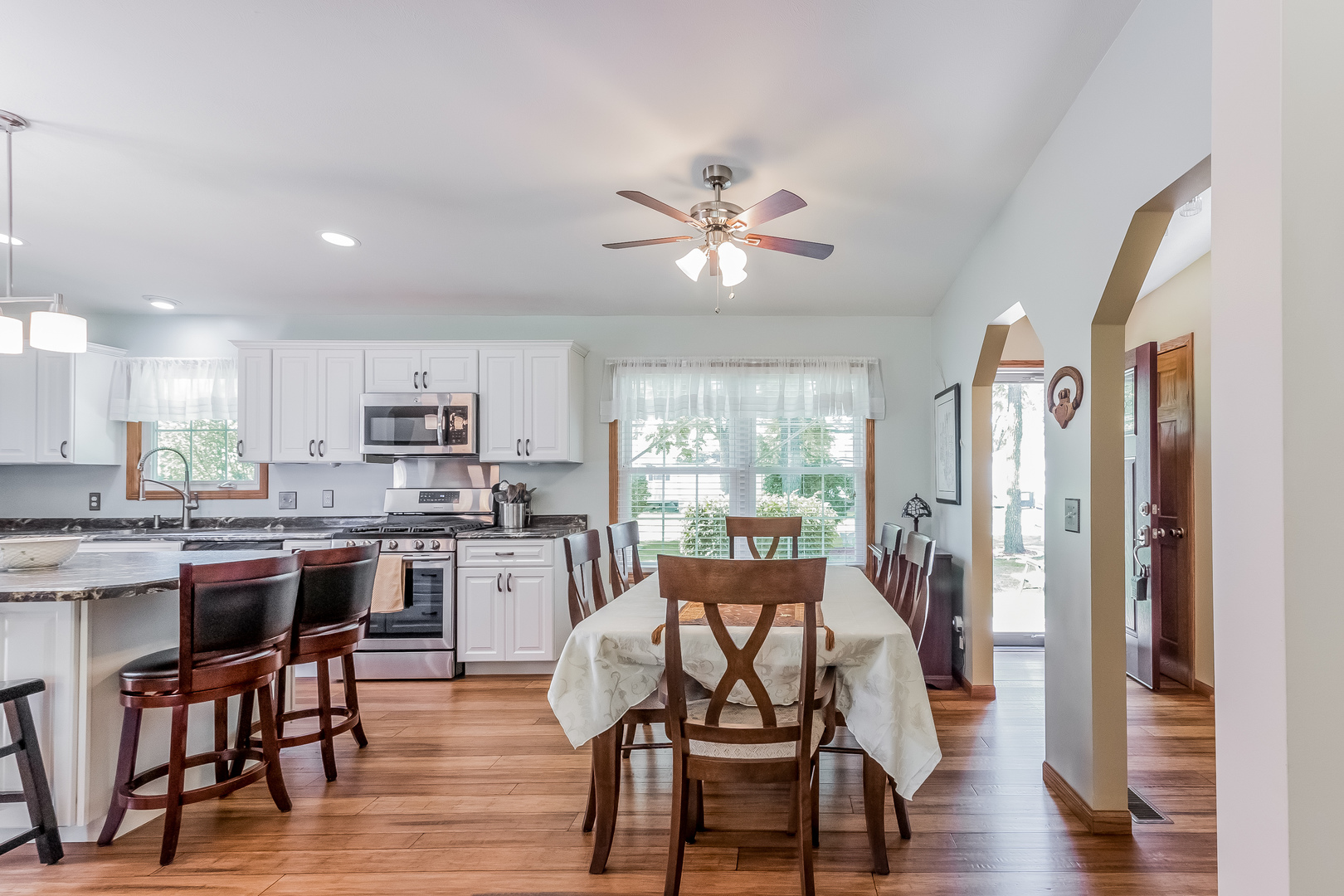 7911 South Sugar Island Road Chebanse, IL 60922 - Photo 7 of 16 a view of a dining room with furniture window and wooden floor