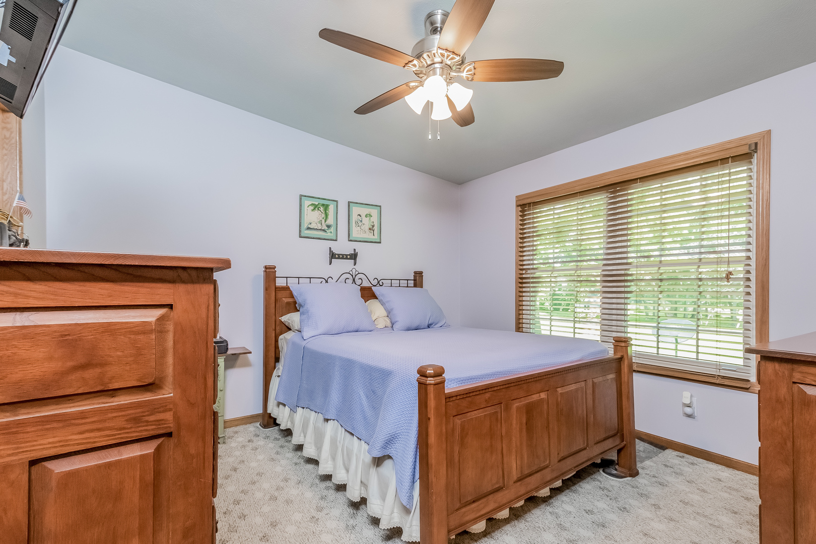 7911 South Sugar Island Road Chebanse, IL 60922 - Photo 8 of 16 a bedroom with a bed and a chandelier