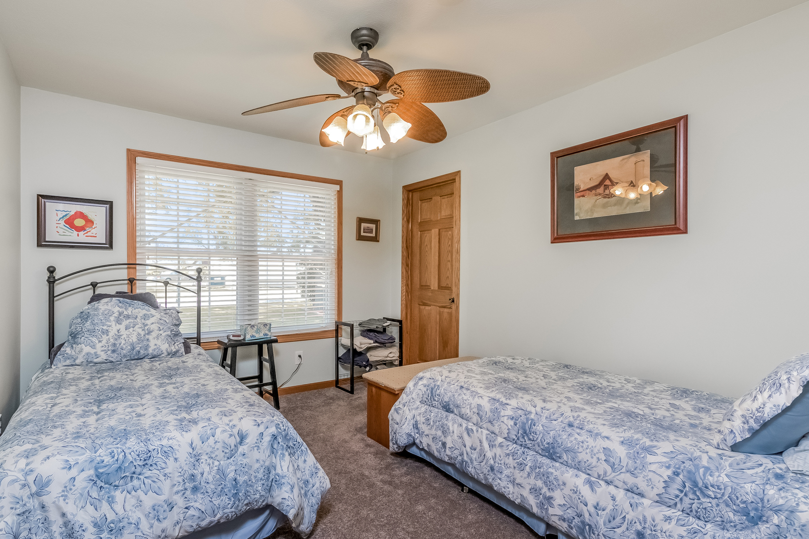 7911 South Sugar Island Road Chebanse, IL 60922 - Photo 10 of 16 a bedroom with a bed and a chandelier