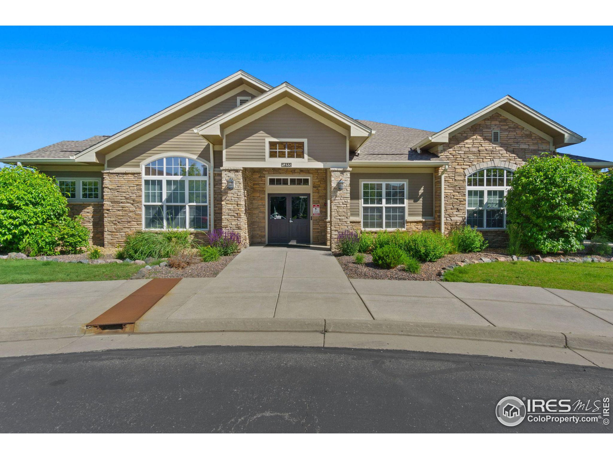 Undisclosed Address Erie, CO 80516 - Photo 13 of 20 a front view of a house with a yard