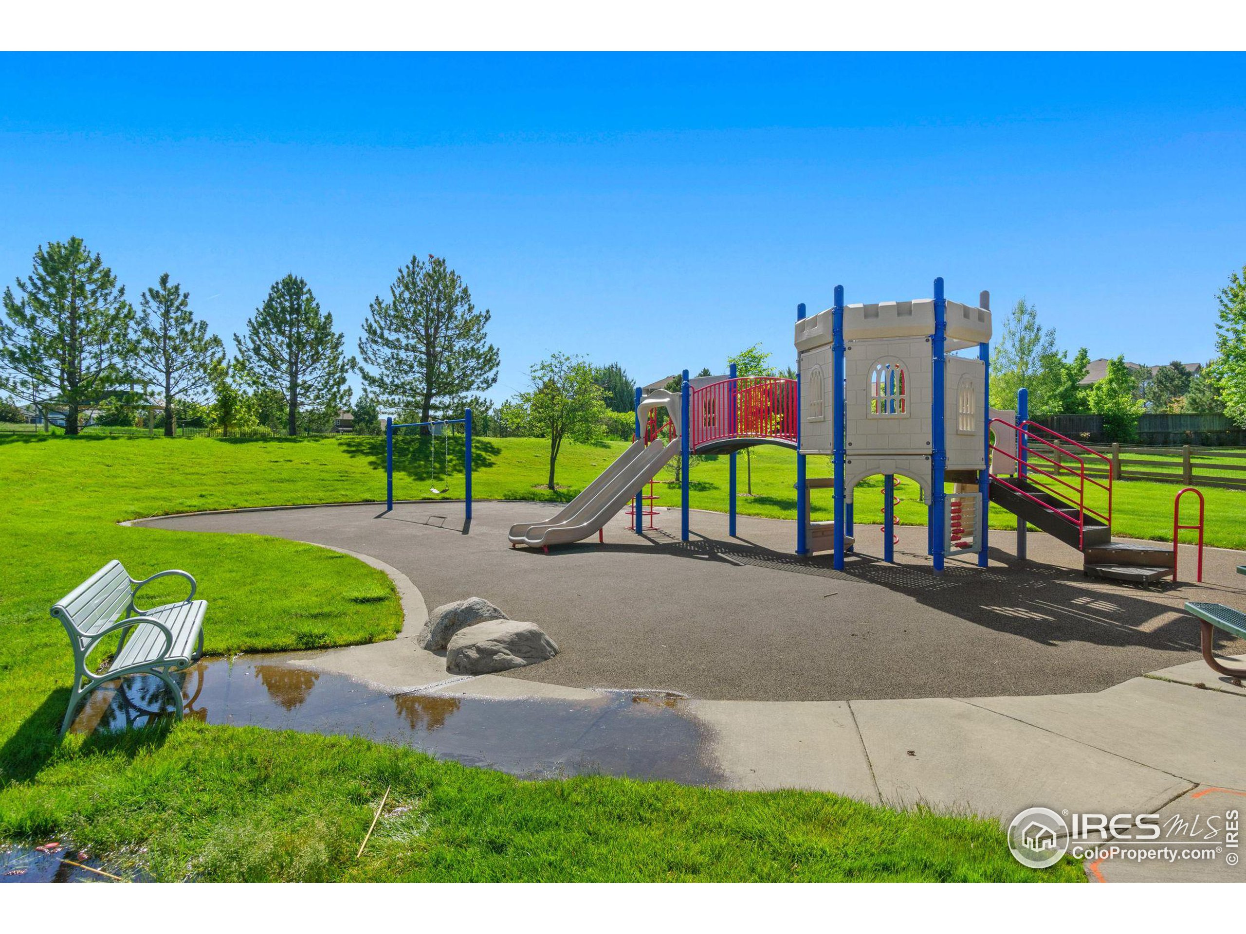 Undisclosed Address Erie, CO 80516 - Photo 14 of 20 a view of a park with swings and slides