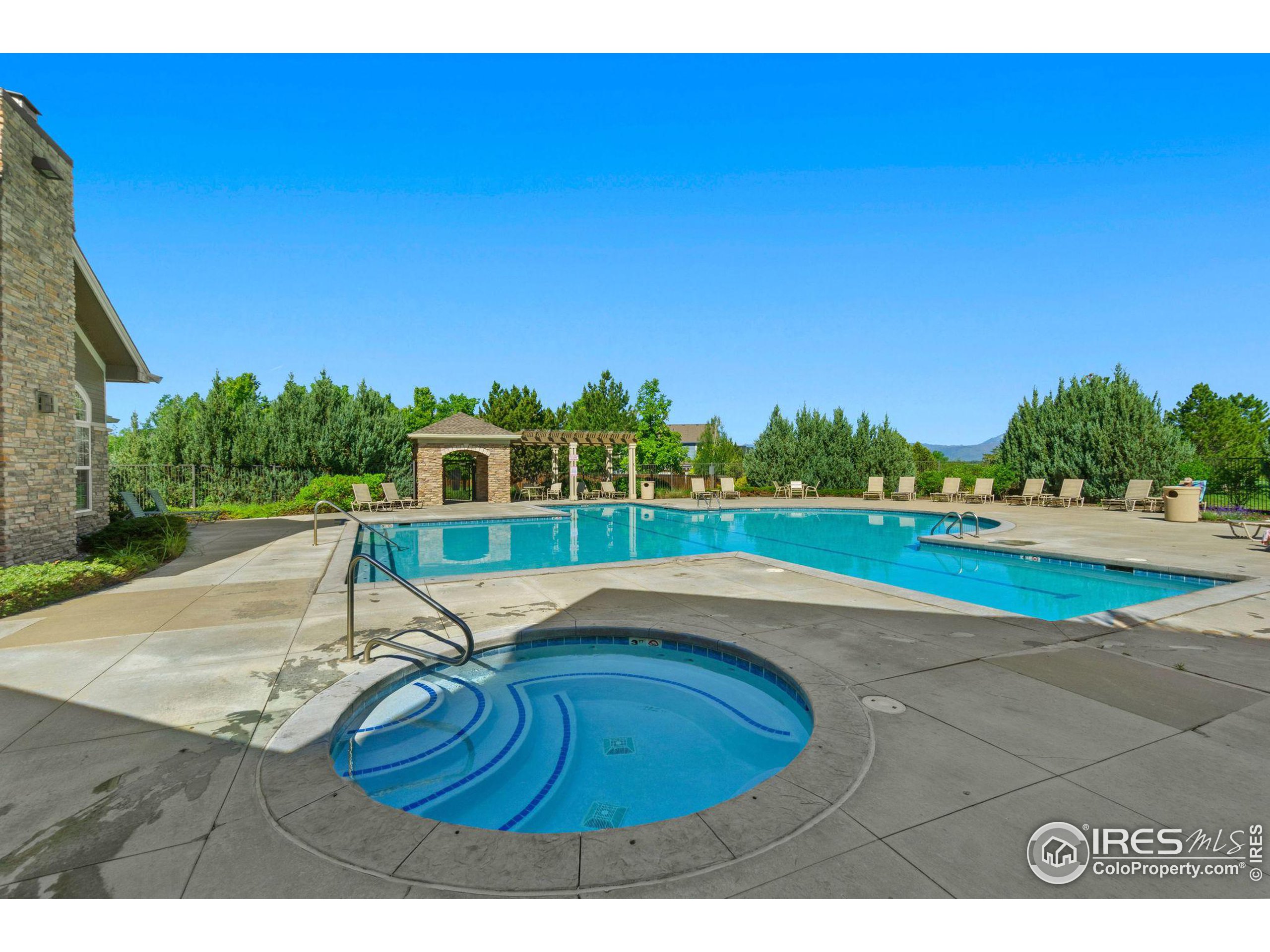 Undisclosed Address Erie, CO 80516 - Photo 15 of 20 a view of a swimming pool with a yard