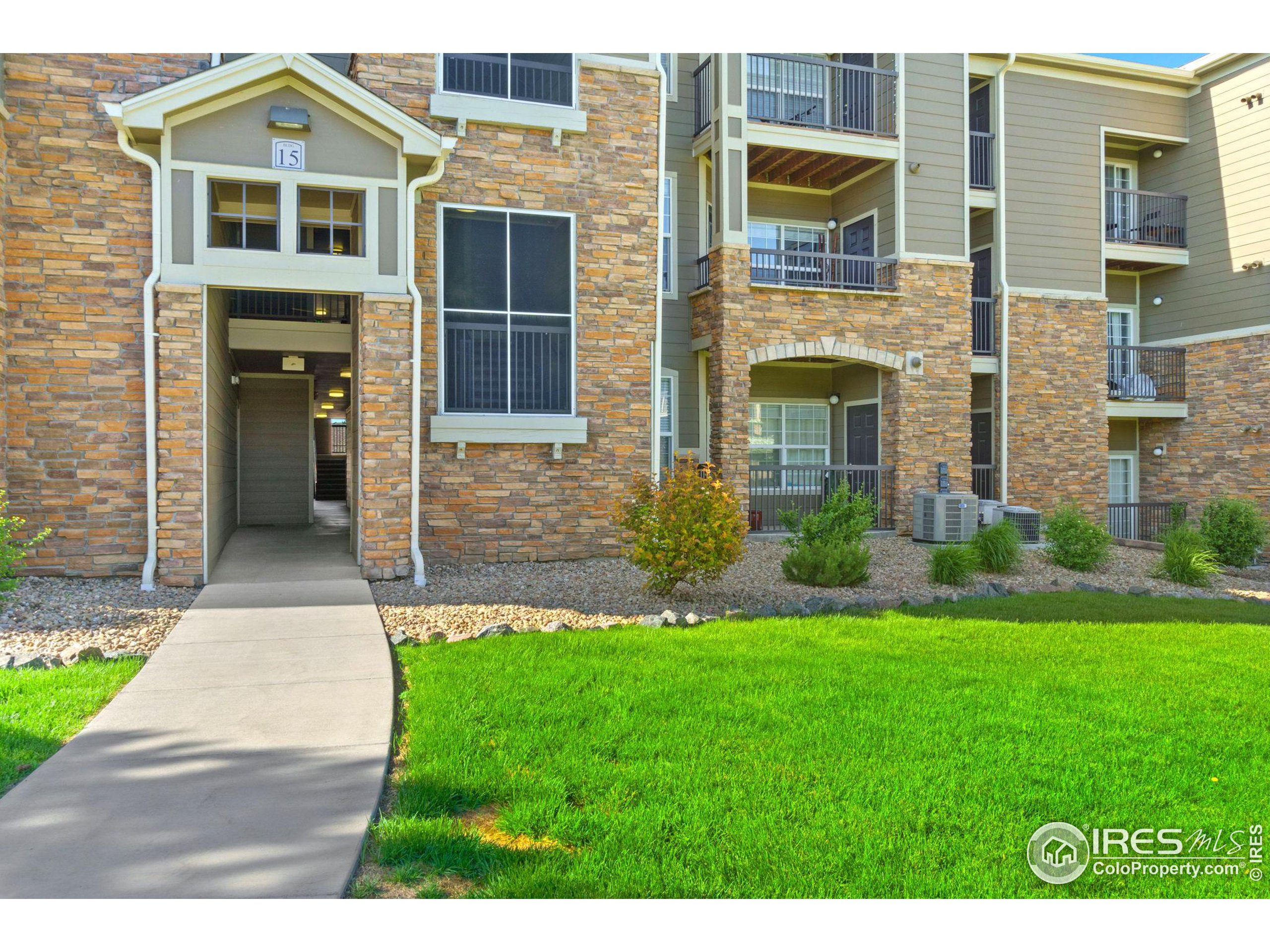Undisclosed Address Erie, CO 80516 - Photo 18 of 20 a front view of a house with a yard