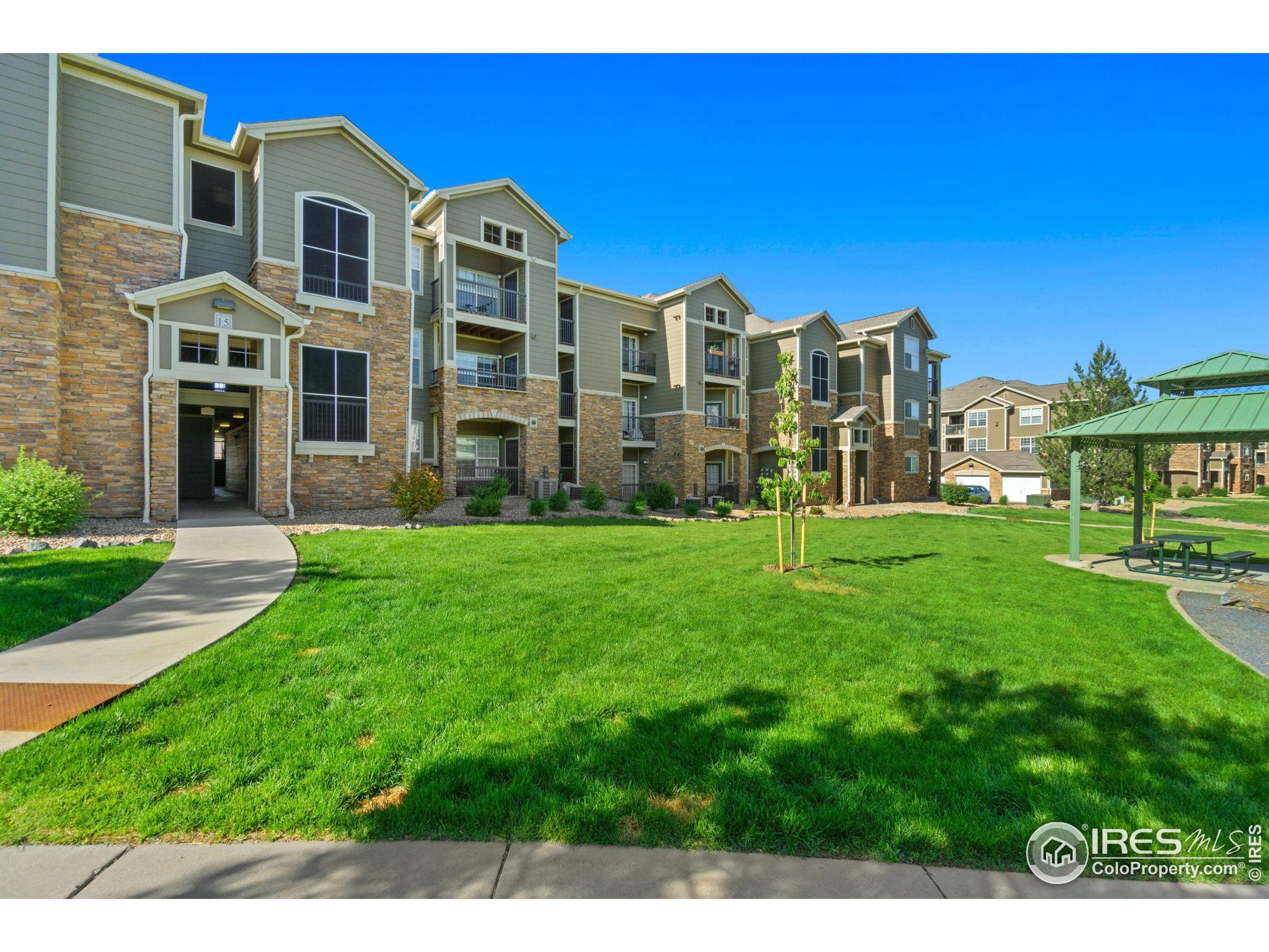 Undisclosed Address Erie, CO 80516 - Photo 19 of 20 a front view of a building with garden