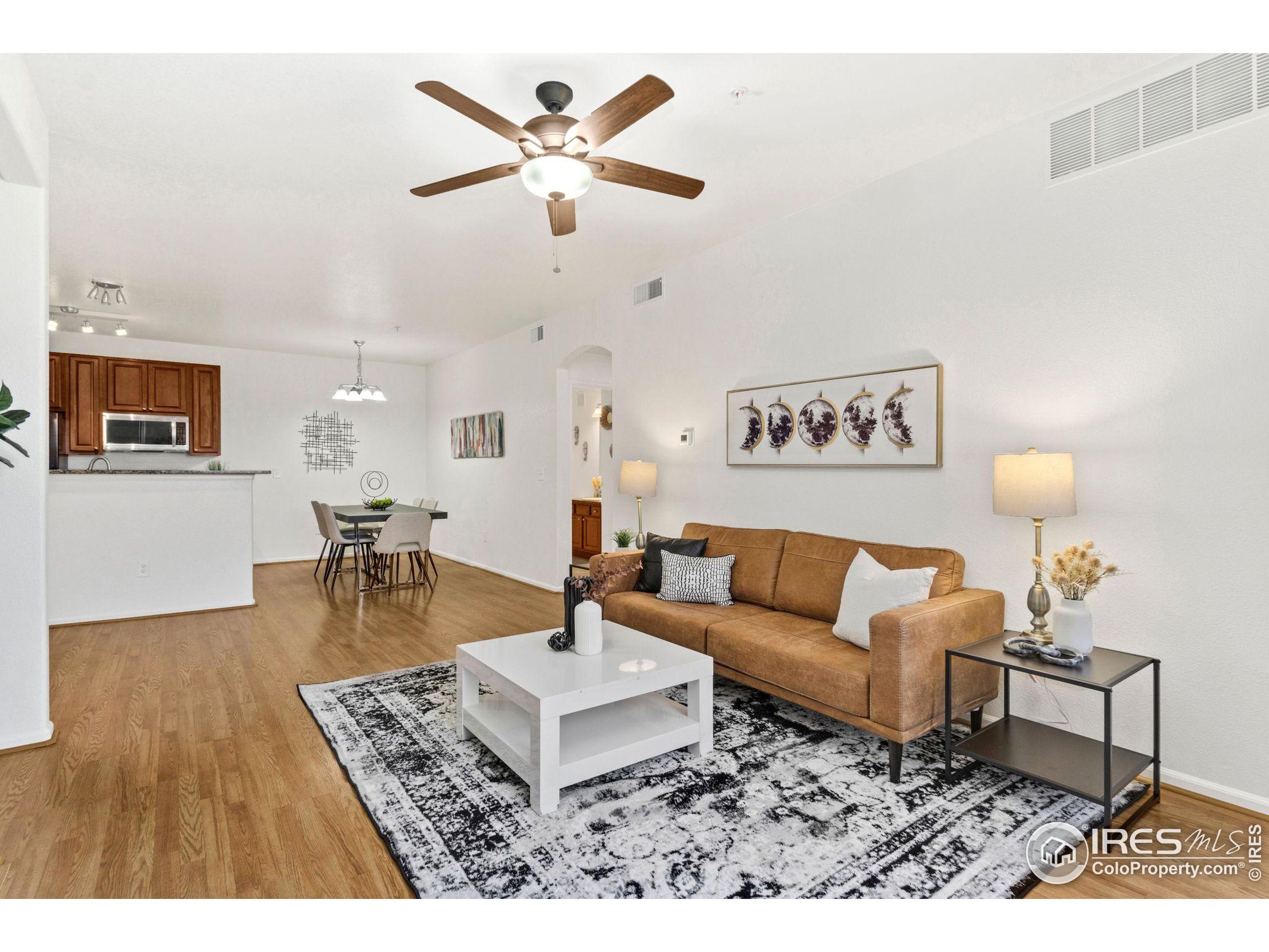 Undisclosed Address Erie, CO 80516 - Photo 2 of 20 a living room with furniture and a table