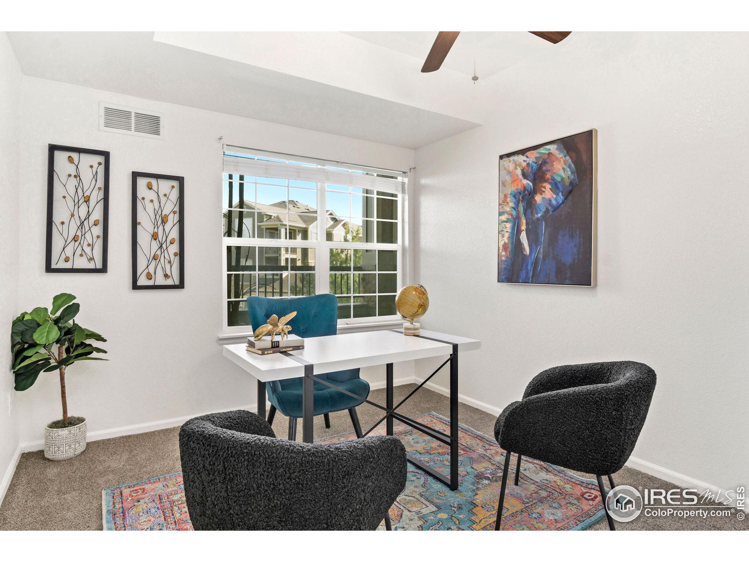 Undisclosed Address Erie, CO 80516 - Photo 10 of 20 a living room with furniture and a large window
