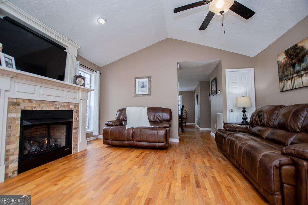 2 Pine Hill Drive Ranburne, AL 36273 - Photo 20 of 91 a living room with furniture and a fireplace