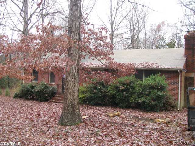 1311 Belle Meade Road Bumpass, VA 23024 - Photo 1 of 5 a backyard of a house with lots of green space