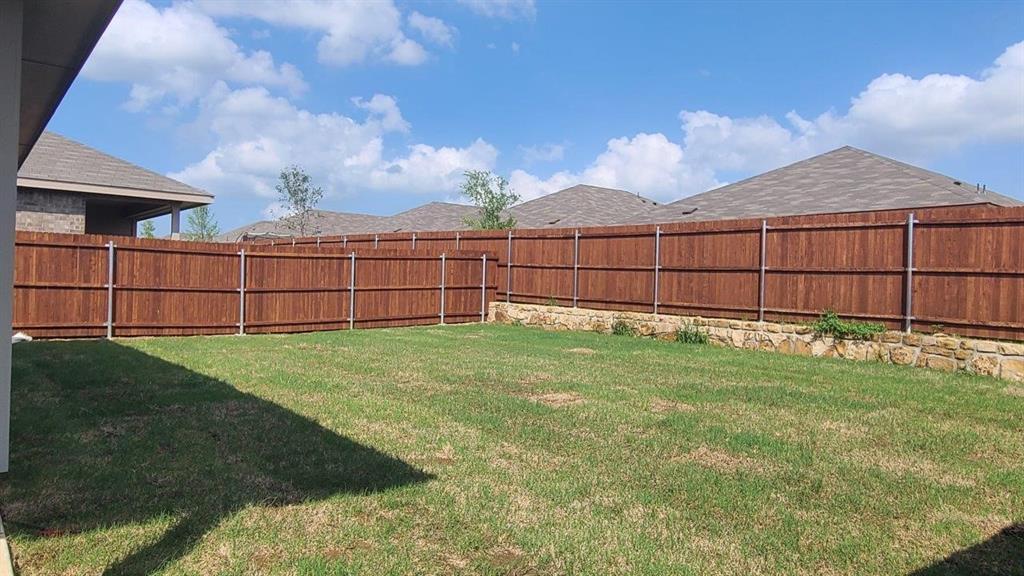 1512 Tin Roof Road Krum, TX 76249 - Photo 11 of 13 a view of a backyard
