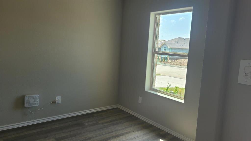 1512 Tin Roof Road Krum, TX 76249 - Photo 3 of 13 an empty room with a window