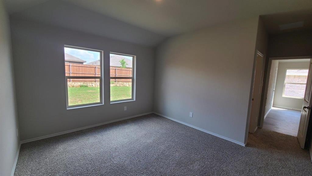 1512 Tin Roof Road Krum, TX 76249 - Photo 5 of 13 an empty room with windows