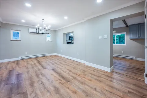a kitchen with stainless steel appliances granite countertop a refrigerator a stove a sink and a microwave