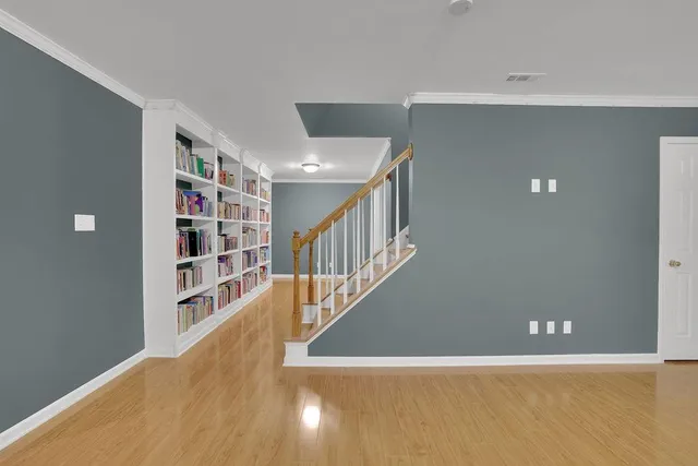 a view of a patio with table and chairs with wooden floor and fence