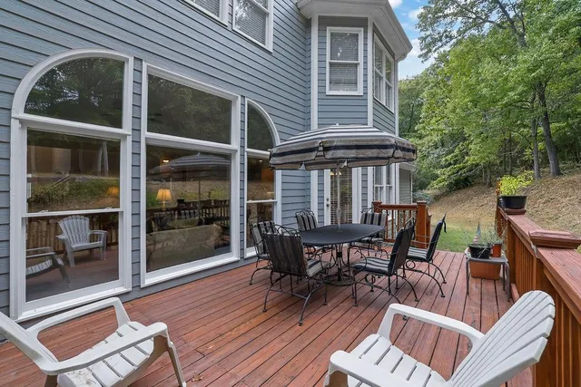 a view of a wooden deck with furniture