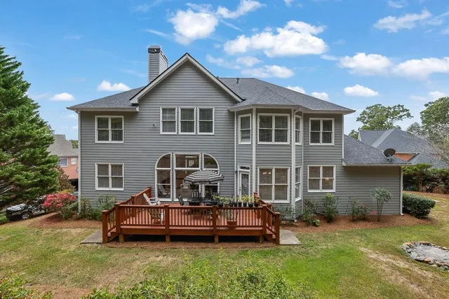 an aerial view of a house with a swimming pool