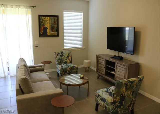 a view of a dining room with furniture and a window