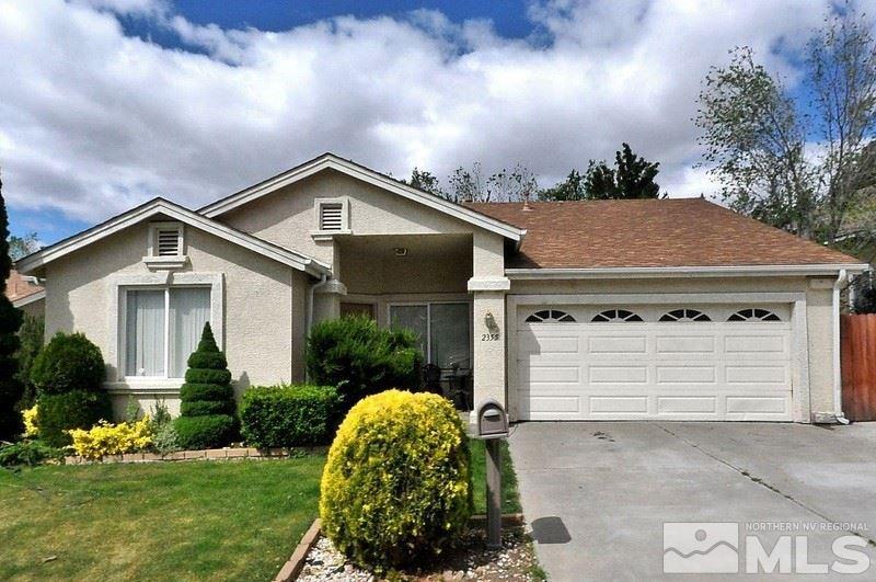 2355 Keystone Avenue Reno, NV 89503 - Photo 1 of 14 a front view of a house with a yard and garage