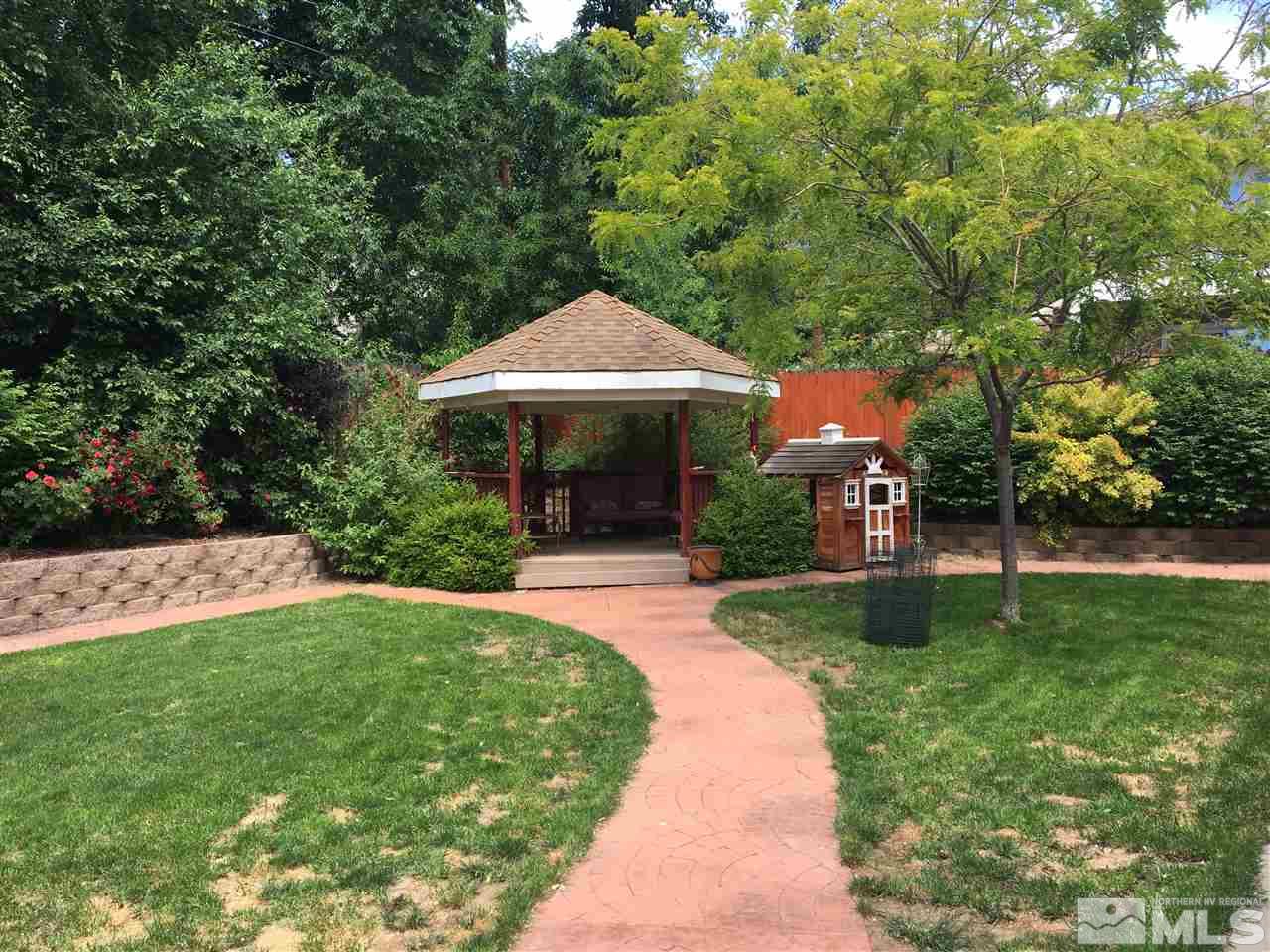 2355 Keystone Avenue Reno, NV 89503 - Photo 13 of 14 a view of a patio with a table and chairs under an umbrella