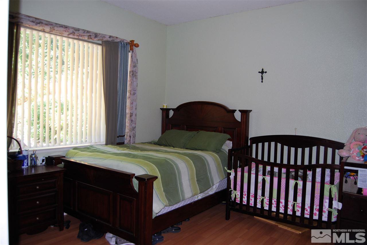2355 Keystone Avenue Reno, NV 89503 - Photo 8 of 14 a bedroom with a bed and a window