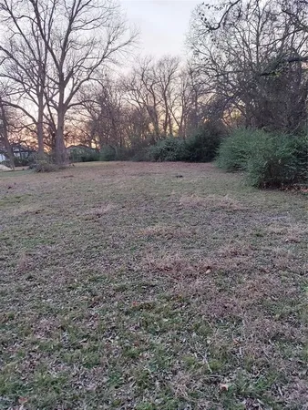 a view of an outdoor space and covered with green space