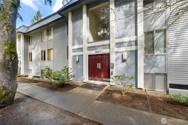 a front view of a brick house with a yard