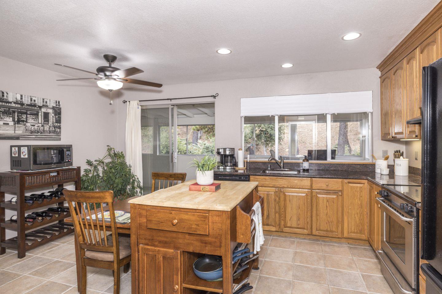 27975 Edgecliff Way Hayward, CA 94542 - Photo 19 of 58 a kitchen with a sink stove and cabinets