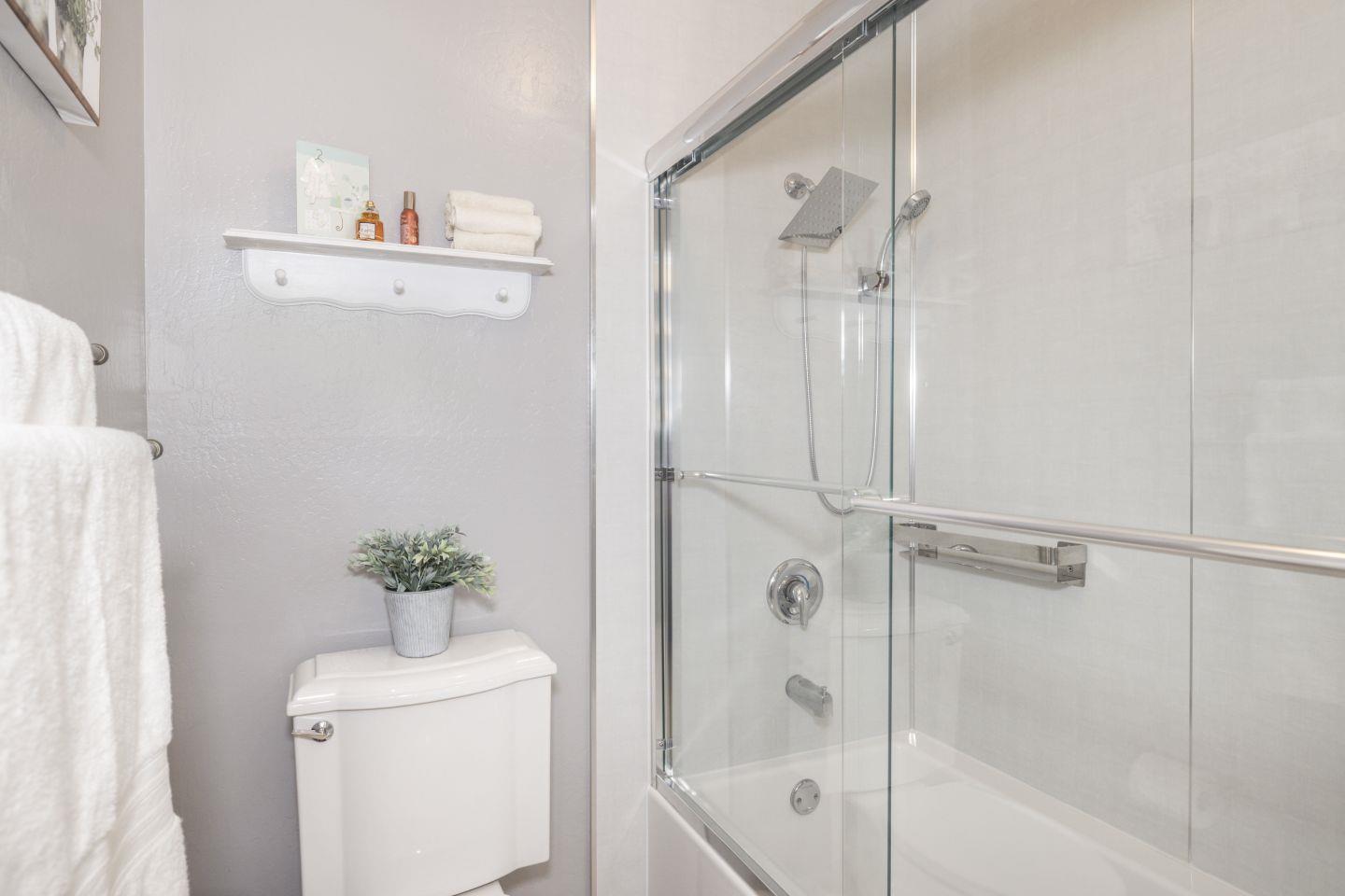 27975 Edgecliff Way Hayward, CA 94542 - Photo 21 of 58 a bathroom with a shower a sink and a mirror