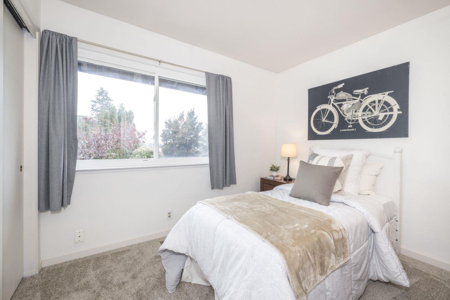 27975 Edgecliff Way Hayward, CA 94542 - Photo 22 of 58 a bedroom with a bed and a window