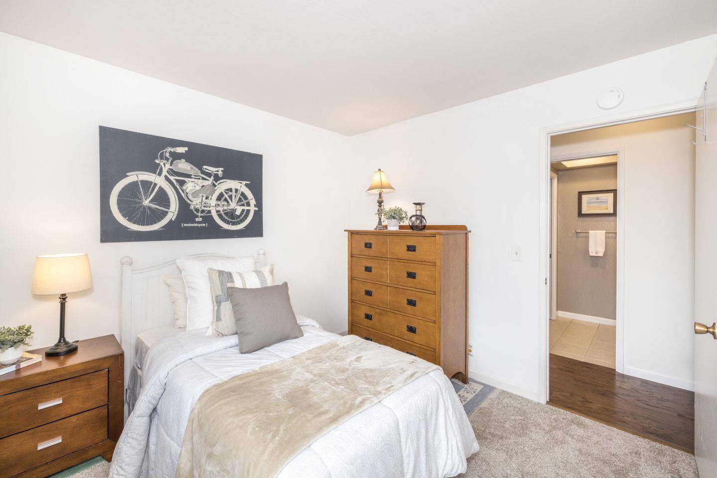 27975 Edgecliff Way Hayward, CA 94542 - Photo 23 of 58 a bedroom with a bed and a lamp on dresser