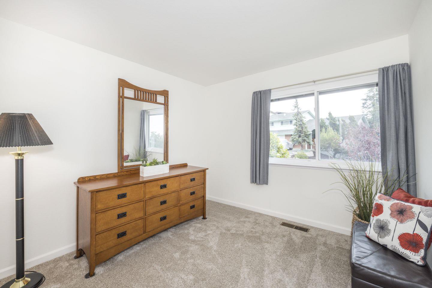 27975 Edgecliff Way Hayward, CA 94542 - Photo 24 of 58 a room with a dresser and a window