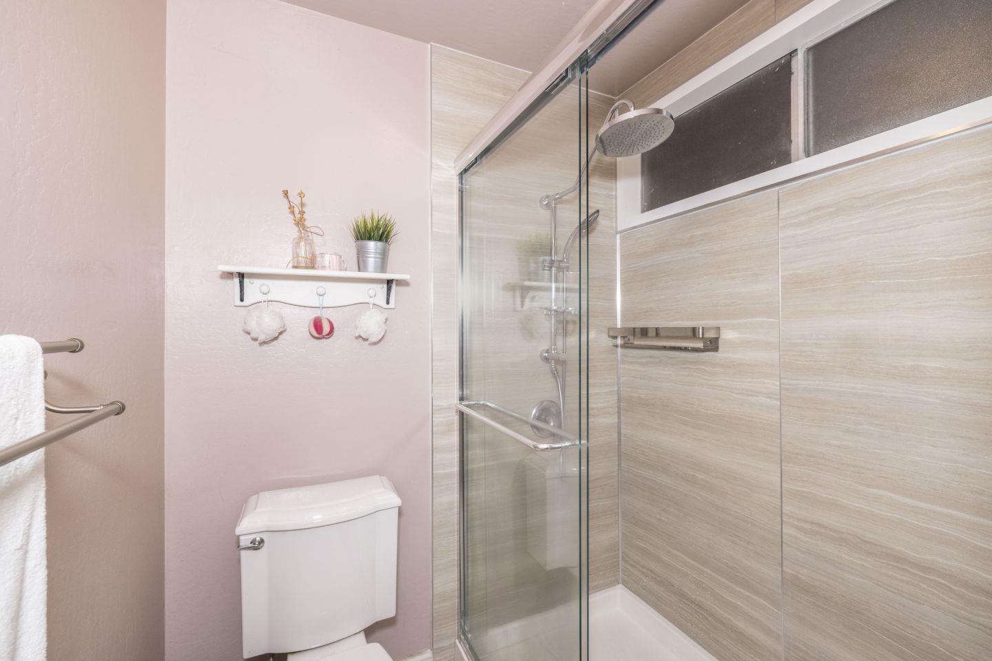 27975 Edgecliff Way Hayward, CA 94542 - Photo 29 of 58 a bathroom with a shower and toilet