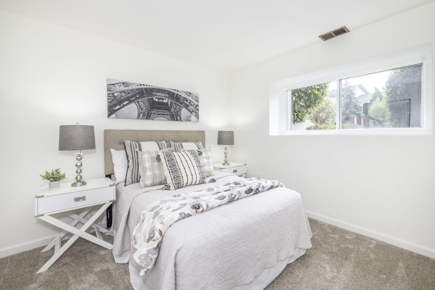 27975 Edgecliff Way Hayward, CA 94542 - Photo 32 of 58 a bedroom with a bed and a painting on the wall