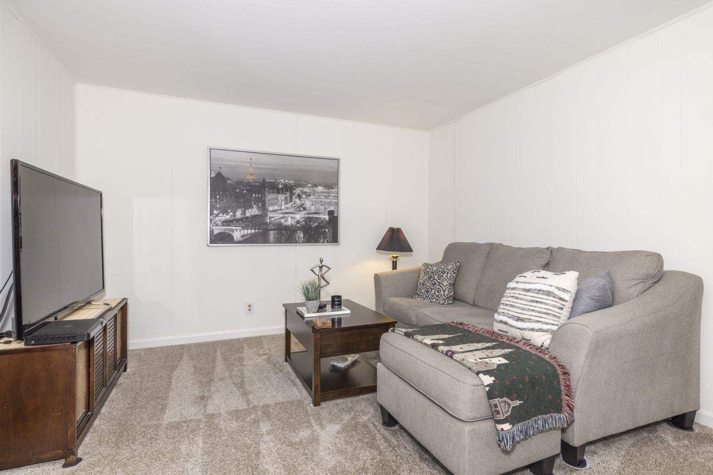 27975 Edgecliff Way Hayward, CA 94542 - Photo 36 of 58 a living room with furniture and a flat screen tv